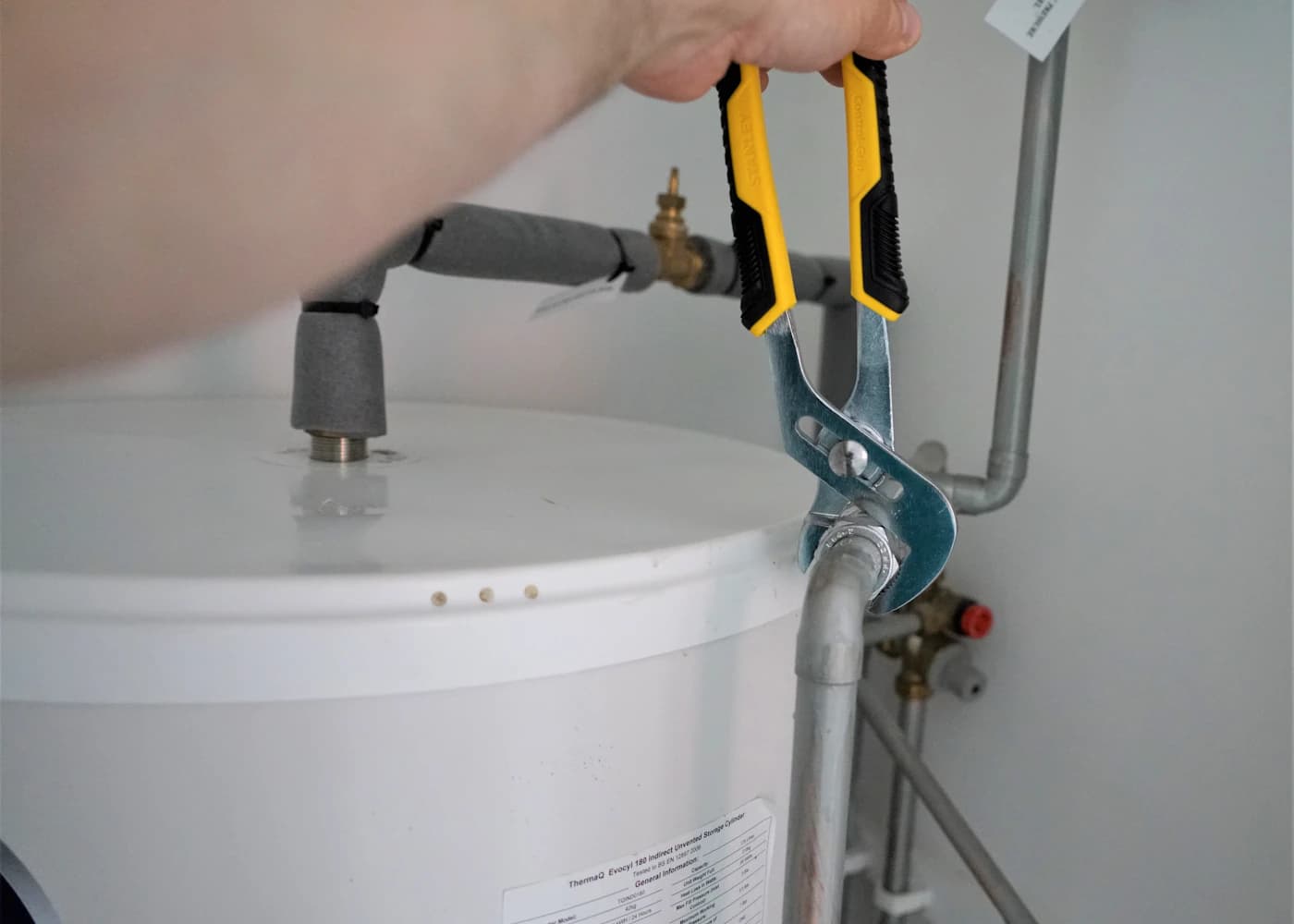 Engineer carrying out careful boiler work